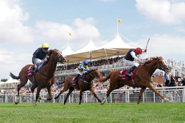 Kyprios ridden by Ryan Moore (right) passes Stradivarius ridden by Andrea Atzeni (left) to win the Al Shaqab Goodwood Cup at the Qatar Goodwood Festival 2022 | Picture via Goodwood Racecourse