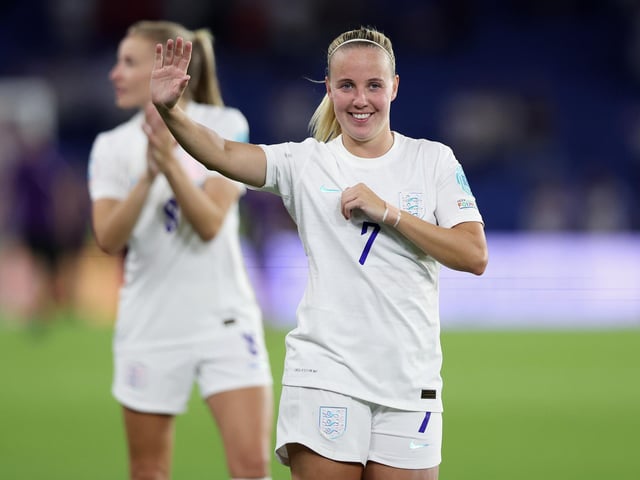 Beth Mead acknowledges the fans after victory.