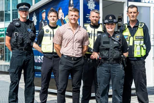 Your Eastbourne BID operations manager Luke Johnson (middle) with police officers by the new engagement hub in the town centre. Picture from Sussex Police
