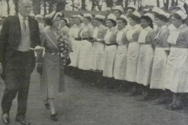 Admiral Sir Charles Little, chairman of the Worthing group hospital management committee, escorting Princess Elizabeth as she inspects members of the nursing staff of Worthing Hospital at Courtlands. Contingents from all hospitals in the group were also inspected by Her Royal Highness.