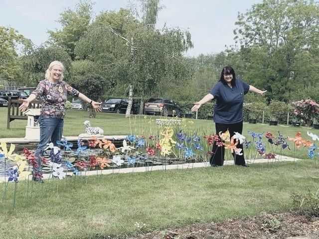 Staff from The Anchorage care home in Pulborough with their colourful creations