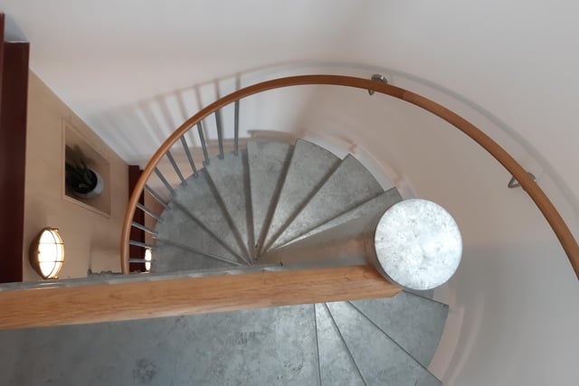 The spiral staircase is a stunning feature of the property