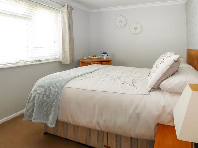 The bedrooms are complemented by a useful storage cupboard that can be accessed from the hallway