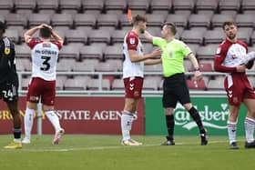 Referee Ross Joyce shows a Red Card to Aaron McGowan ( #3) of Northampton Town during the Sky Bet League Two between Northampton Town and Crawley Town at Sixfields on March 04, 2023 in Northampton, England. (Photo by Pete Norton/Getty Images)
