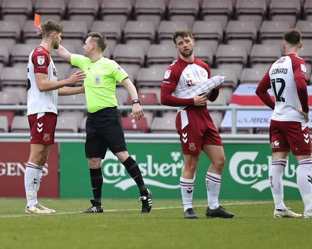 Referee Ross Joyce shows a Red Card to Aaron McGowan ( #3) of Northampton Town during the Sky Bet League Two between Northampton Town and Crawley Town at Sixfields on March 04, 2023 in Northampton, England. (Photo by Pete Norton/Getty Images)
