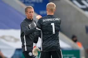 Brighton's English manager Graham Potter gestures with Leicester City's Danish goalkeeper Kasper Schmeichel at the final whistle during the English Premier League football match between Leicester City and  at the King Power Stadium