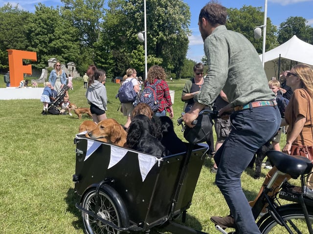 Entrepreneur James Middleton rode around the site with a basket full of dogs on his Babboe bike.