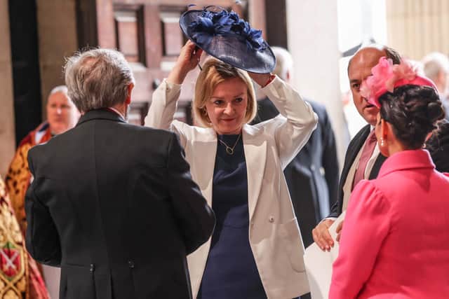 Liz Truss talks to Priti Patel and Ben Wallace after arriving for the start of the service of thanksgiving for the Queen at Str Paul's cathedral on June 3, 2022 (Photo by Richard Pohle - WPA Pool/Getty Images)