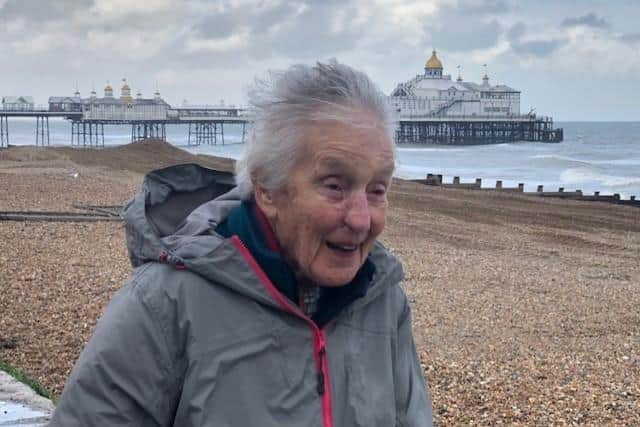 Elizabeth Wilson, aged 95, braves bad weather on Eastbourne seafront during a seven and a half mile walk