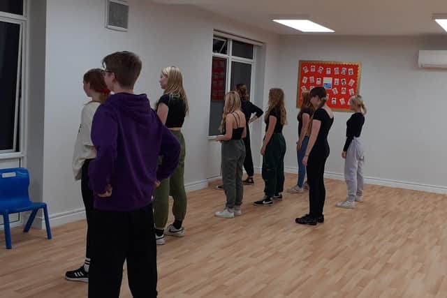 Senior show class practising dance routine
