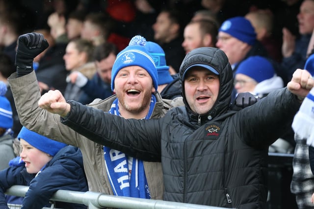Hartlepool United supporters celebrate their 2-1 victory over Harrogate Town. (Credit: Mark Fletcher | MI News)