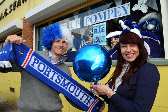 Steve Searle and Sarah Wellham hold a Portsmouth scarf outside U-Need-Us in May 2010 ahead of the FA Cup final which Pompey played in. Picture: Ian Hargreaves (101530-1)