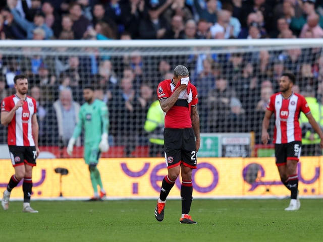 SHEFFIELD, ENGLAND - FEBRUARY 18: Vinicius Souza looks dejected after an own goal by Jack Robinson of Sheffield United (obscured) during the Premier League match between Sheffield United and Brighton & Hove Albion at Bramall Lane on February 18, 2024 in Sheffield, England. (Photo by Matt McNulty/Getty Images)