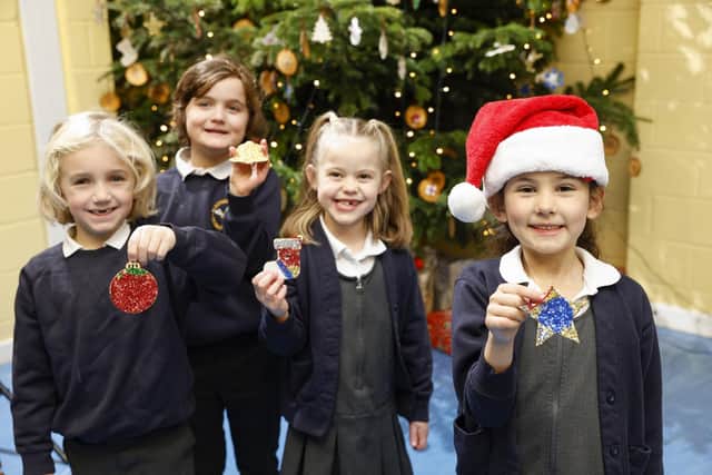 Aldingbourne Primary School children with the Christmas decorations they created