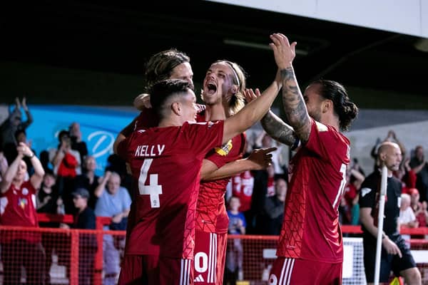 Liam Kelly, Ronan Darcy and Dom Telford celebrate with goalscorer Danilo Orsi. Reds beat MK Dons 2-1 to put them third in the League table. Picture: Eva Gilbert