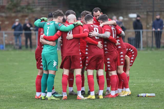 Worthing FC show their togetherness at Hampton | Picture: Mike Gunn