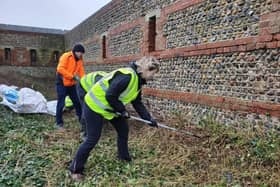 Littlehampton Fort Restoration Project volunteers working on clearing the vegetation