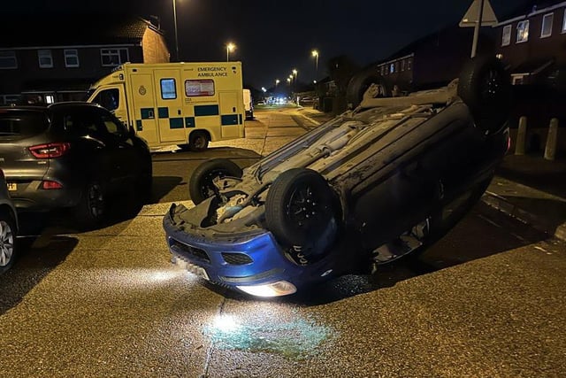 A car flipped over after a collision in Hurstfield, Lancing