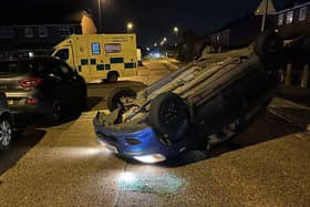 A car flipped over after a collision in Hurstfield, Lancing
