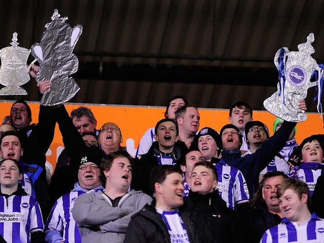 Brighton fans get their homemade FA Cups out before the FA Cup Fifth round replay between Hull City and Brighton & Hove Albion at KC Stadium on February 24, 2014 in Hull.