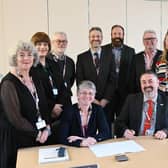 QVH's Chair of the Board, Chief Executive Officer and Board of Directors signing the charter.