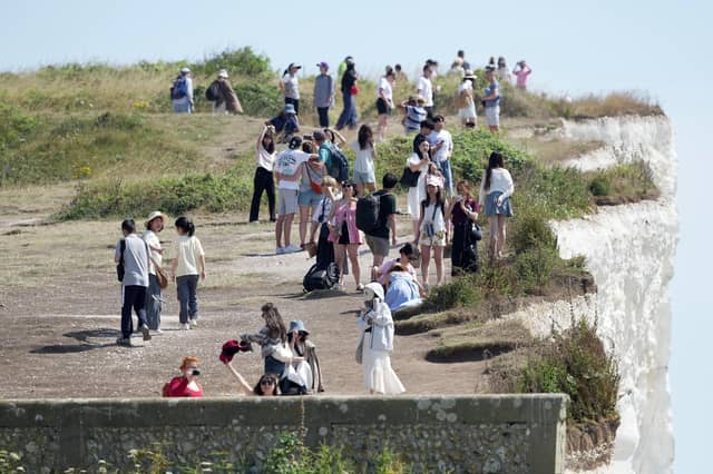 Shocking photos show sunbaskers standing near edge of cliffs at Birling Gap