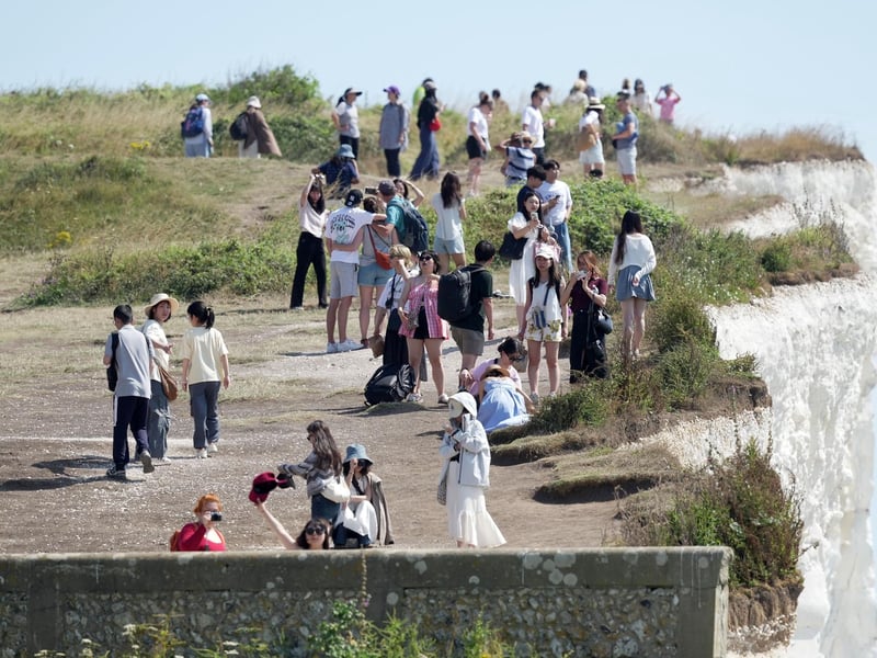 Shocking photos show sunbaskers standing near edge of cliffs at Birling Gap
