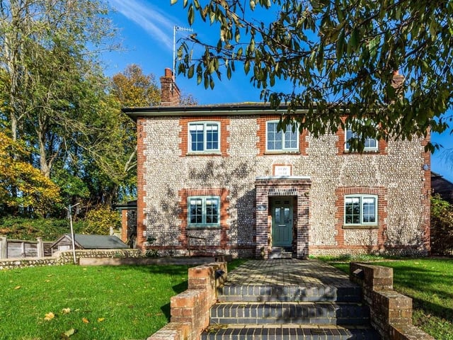 This stunning flint-and-brick detached house dates to the 1800s and used to be a pub. It was converted in about 2016 and boasts four bedrooms, three reception rooms and mature, secluded gardens.