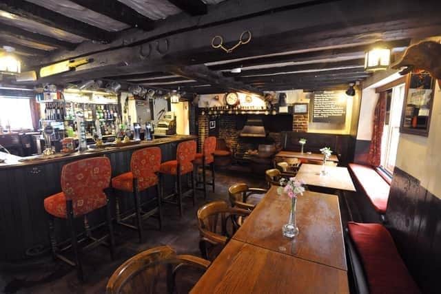 The Eight Bells in Jevington, which was voted as the Best Sussex Pub at the Brighton Restaurants Awards Vote Online, has applied for the license to play live recorded music at the pub until 1am. Picture: Stephen Curtis