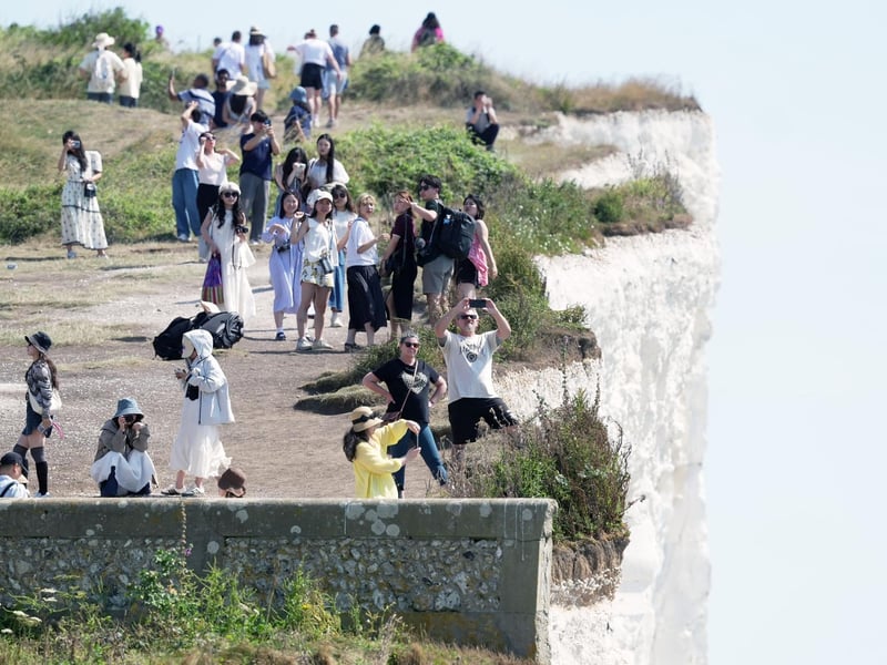 Shocking photos show sunbaskers standing near edge of cliffs at Birling Gap