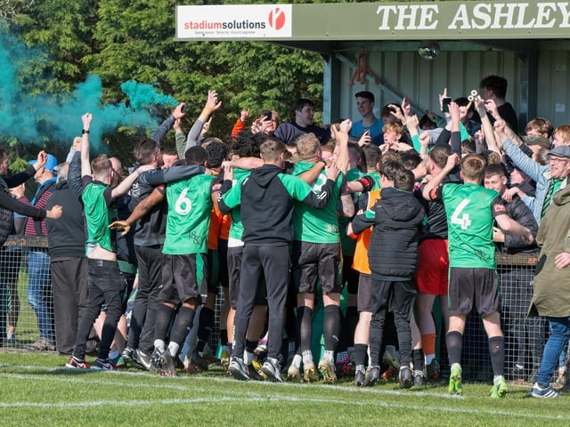 Burgess Hill Town players, fans and staff celebrate surviving in the Isthmian south east division at the end of their 0-0 draw with Beckenham