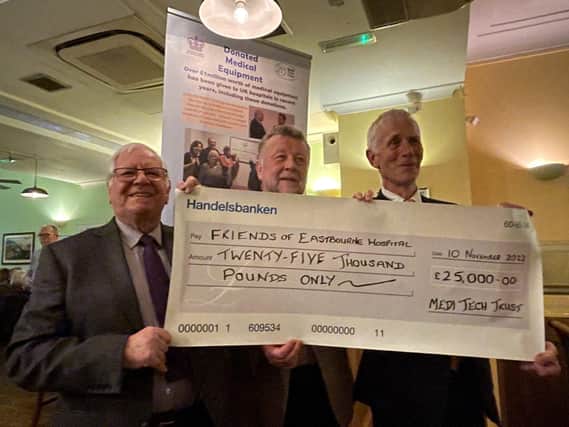 Bob Lewis and Graham Watson preenting Harry Walmsley with a cheque for £25,000
