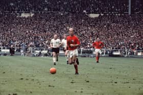 Bobby Charlton with the ball during the 1966 World Cup Final against West Germany at Wembley Stadium. England won 4-2.  (Photo by Fox Photos/Getty Images)