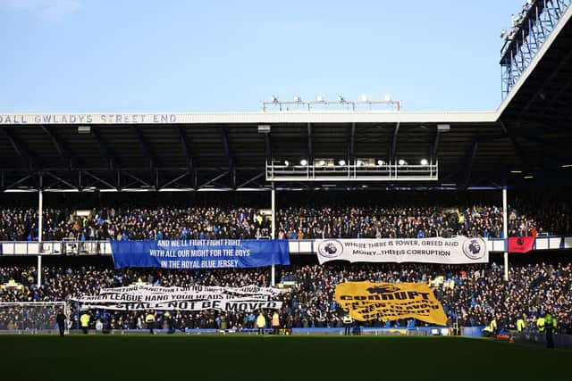 Everton fans hold banners in protestat their club's points deduction over Financial Fair Play rules  (Photo by Michael Regan/Getty Images)