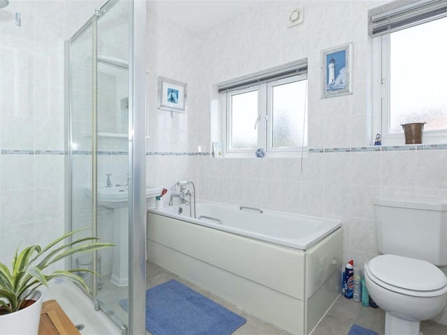 This end-of-terrace, five-bedroom property is on a corner plot in Grand Avenue, just a short walk from the town centre and yards from the beach. It has come on the market with Robert Luff & Co priced at £850,000.