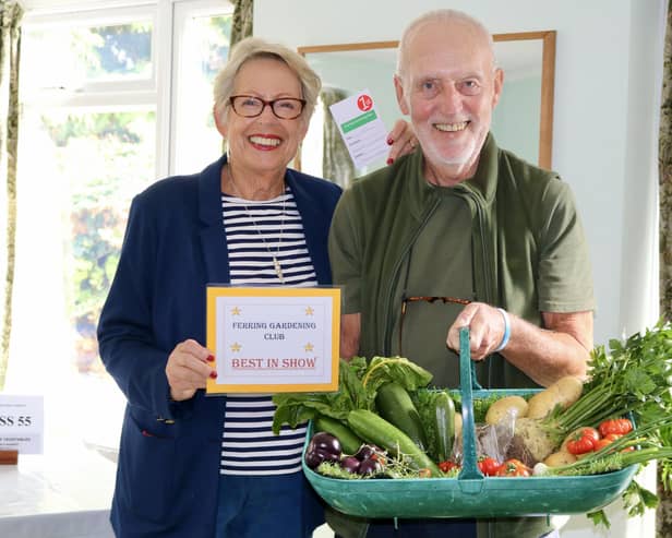 Robert Fisher being awarded best in show for his collection of vegetables