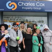 Matthew Cox with staff outside new office premises in Willingdon.