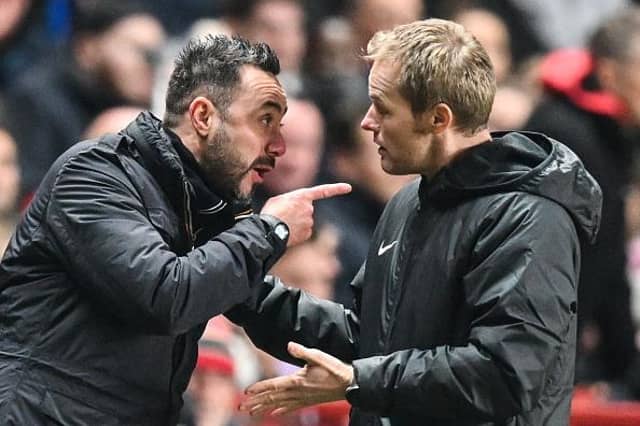 Brighton's Italian head coach Roberto De Zerbi argues with fourth official referee during the English League Cup fourth round defeat