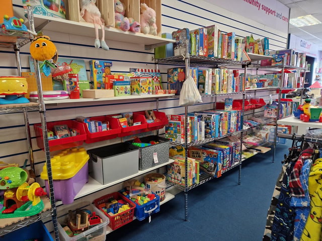 Inside Guild Care's new shop dedicated to children's toys, clothes and equipment, as influencer Jen Graham, known as Charity Shop Girl cuts the ribbon to officially open the Portland Road store