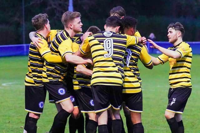 Haywards Heath celebrate one of the two goals that earned a point v Midhurst | Picture: Ray Turner