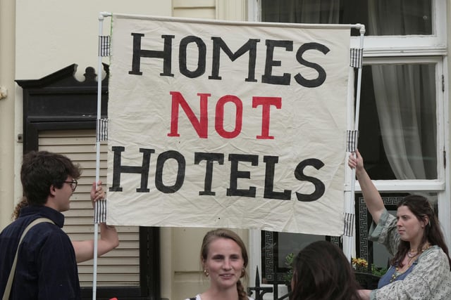 Brighton: Activists protest over reopening of refugee hotel outside Brighton Town Hall tonight.