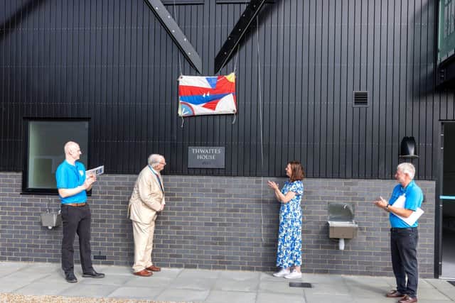 Mark Sheldrake, Sir Bryan Thwaites, Sara Sutcliffe and Norman Doney, uncovering the name plaque.