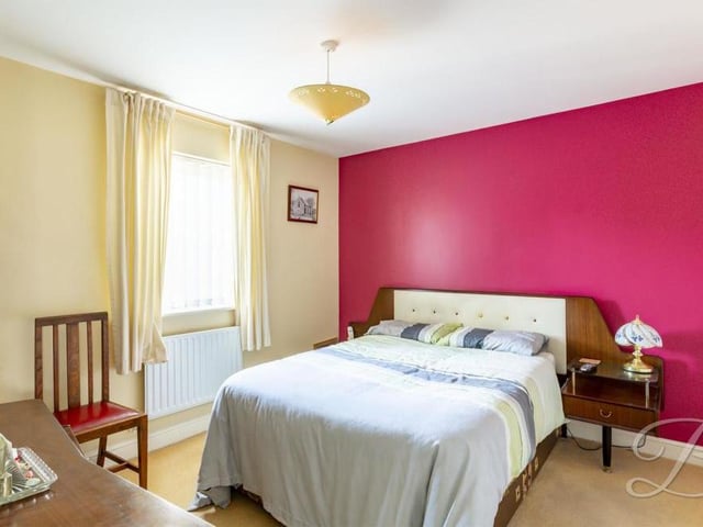 Once you are upstairs, the landing leads you to all four well-appointed bedrooms, starting with this pleasant master. It has a carpeted floor, central heating radiator and window facing the front of the house.