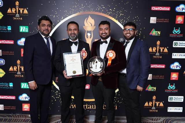 Pictured with their award are: Darchini owner Syed Hossain, his sons Naeem and Fahim and Syed's brother Shahin