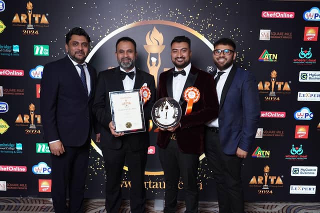 Pictured with their award are: Darchini owner Syed Hossain, his sons Naeem and Fahim and Syed's brother Shahin