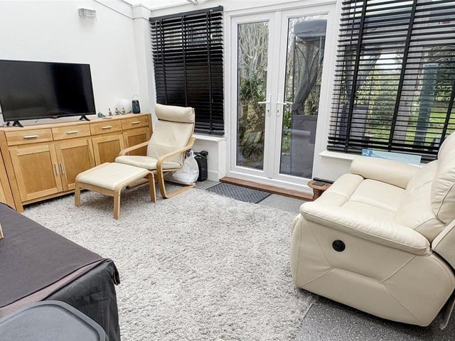The conservatory overlooks the garden and gives access to a useful cloakroom and utility area