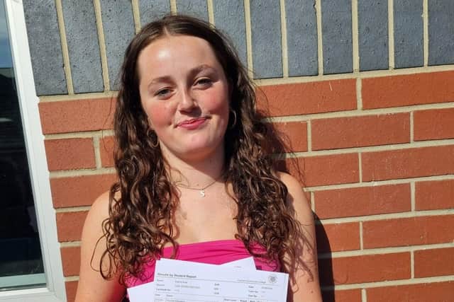 FCC Student proudly showing off their results