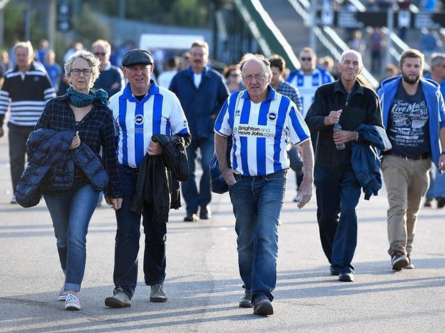 Brighton & Hove Albion supporters make their way to the stadium prior to the Sky Bet Championship match between Brighton & Hove Albion and Rotherham United at Amex Stadium on August 16, 2016.