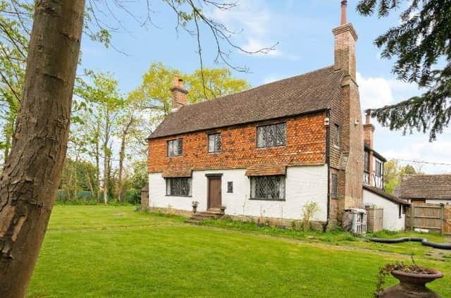 This Grade II listed five-bedroom property - Langley Grange - is on sale through agents Savills with a guide price of £850,000
