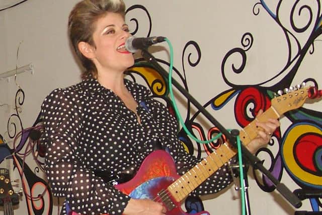 Tina Oberman plays guitar professionally as well as teaching it to her students